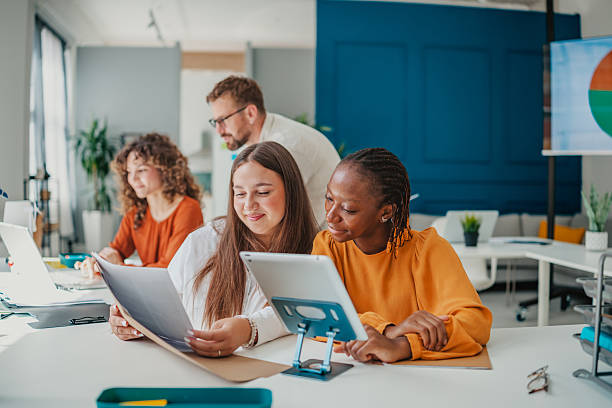 istock Young professionals collaborate in a modern startup office while sharing ideas and planning for success 2236740162