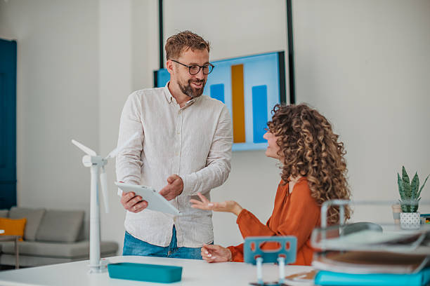istock Young professionals collaborate in a modern startup office, sharing ideas and planning for business growth 2236740362