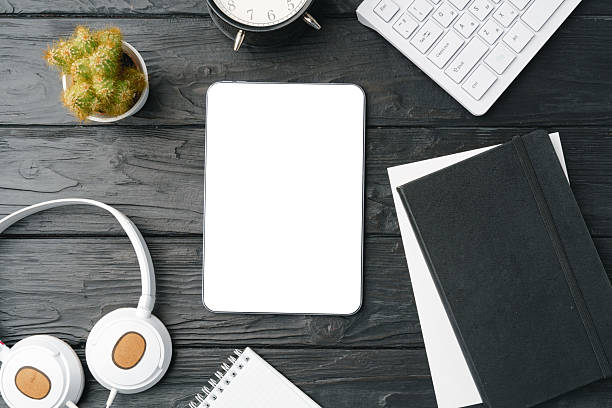 istock Office supplies and digital tablet on office table 2236740400