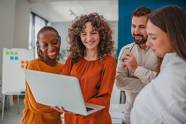 istock Young professionals collaborate in a startup office, sharing ideas and solutions with enthusiasm and teamwork 2236740585