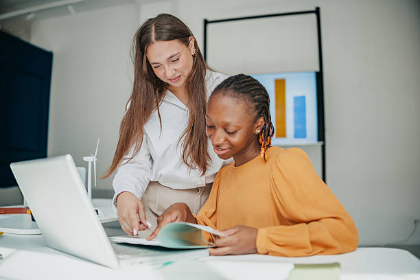 istock Young professionals collaborating and sharing ideas in a modern startup office setting 2236741088