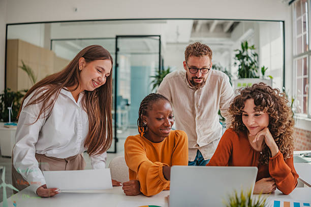 istock Young professionals collaborating in a bright startup office environment during a productive team meeting 2236741178