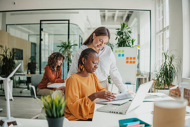 istock Young professionals collaborating in a bright startup office while brainstorming ideas for their new business 2236741229