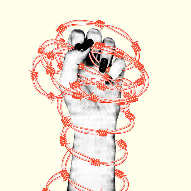 istock Revolutionary retro collage illustrating the struggle for freedom and equality with a hand bound by barbed wire. 2236741366