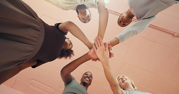 istock Exercise, hand stack and unity with woman friends in studio together for pilates class from below. Circle, fitness and solidarity with group of people in health club for bonding, training or wellness 2236741620