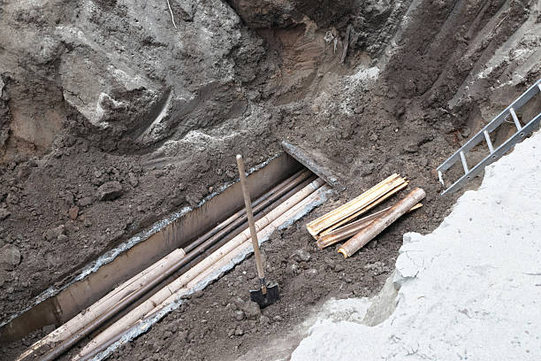 istock Underground construction site showing pipes and excavation tools 2236743763