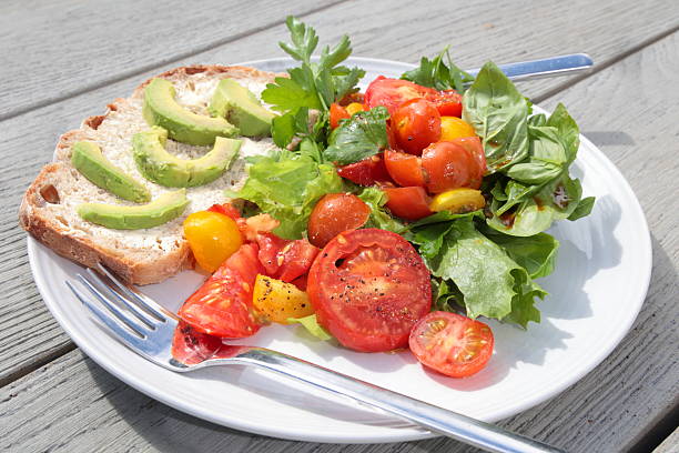 Fresh salad with tomatoes and arugula. Close-up.