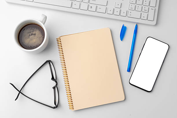 istock Office desk with laptop, blank notebook and coffee cup 2236746406