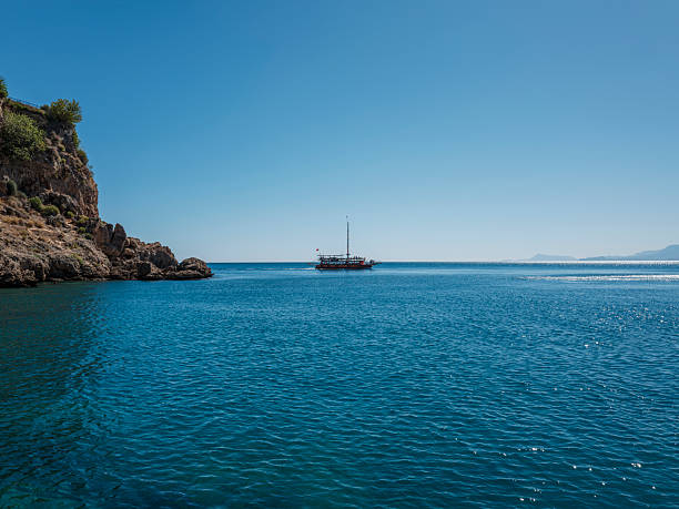 Sailing cruise in Turkey. Beautiful white yachts, sailboats or sail boats sailing at sea on a calm, bright sunny day