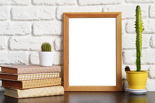 istock Books with picture frame on wooden table 2236747814