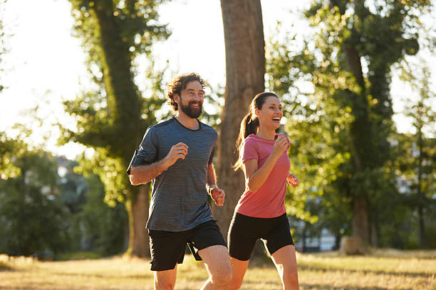 istock Energetic young adults running in nature 2236748431