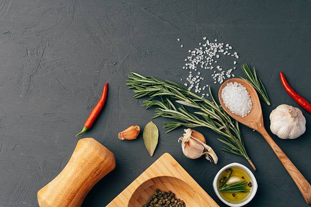 istock Wooden spoon and different spices on black background 2236749195