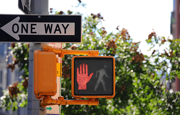 istock pedestrian traffic light with red hand and one way arrow at a pe 2236749381