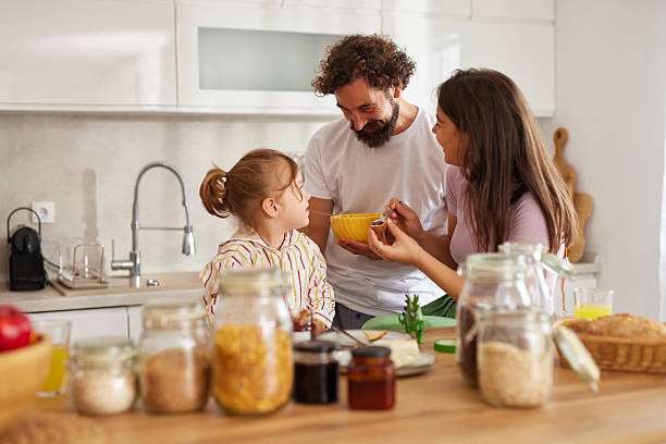 istock Family enjoying breakfast together in modern kitchen 2236751377