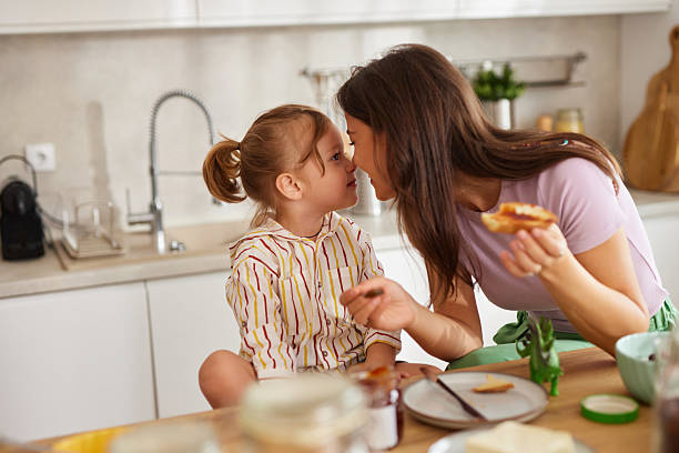 istock Mother and daughter bonding during breakfast at home 2236751677