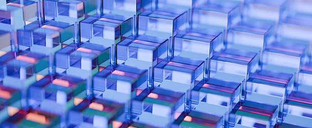istock Abstract background of crystal clear glass blocks forming a textured pattern. Transparent material with iridescent reflections, creating vivid prismatic shapes and a dynamic, enchanting 3D render. 2236752927