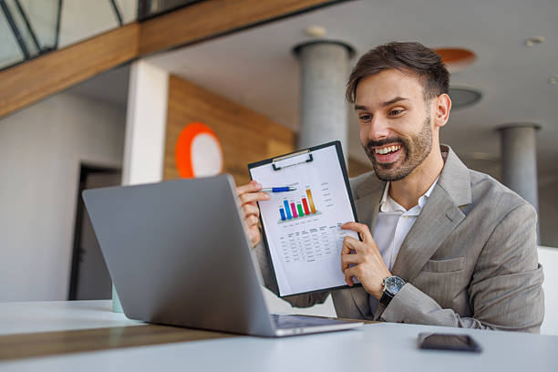 istock Young businessman presenting financial data during online meeting 2236753932