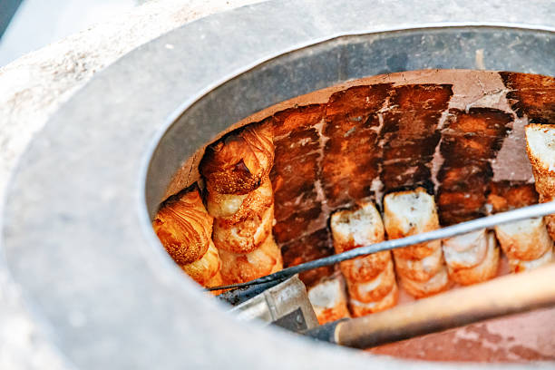 Preparing of Uzbek Samsa or Sambousak oriental meal stuffed with meat, cheese or vegetables at street market bazar in Samarkand or Bukhara, Uzbekistan