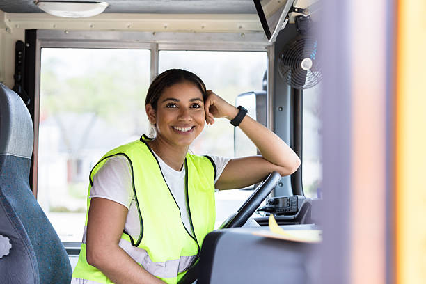 istock Confident Young Latina Woman School Bus Driver Smiling 2236755899