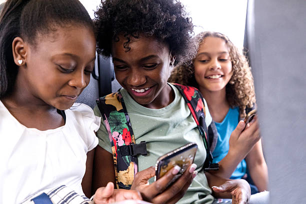 istock Three Girls Sharing a Smart Phone, Casual, Joyful 2236755926