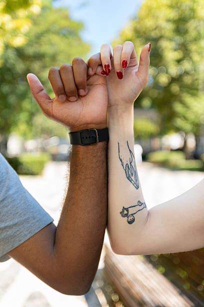 istock Multiethnic hands holding the pinky finger 2236756071