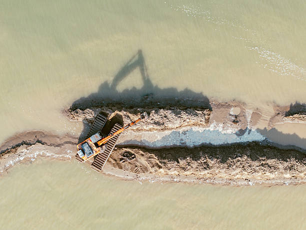 Aerial view of Excavator working on the seaside / shandong, China
