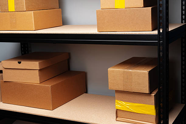 istock Rack shelves with paper boxes in warehouse. 2236758014