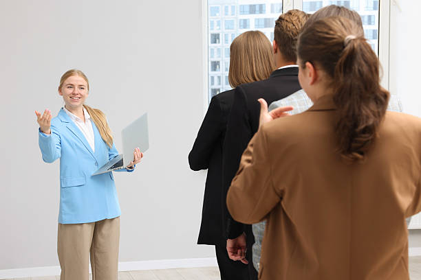 istock Group of people waiting in queue indoors 2236758085