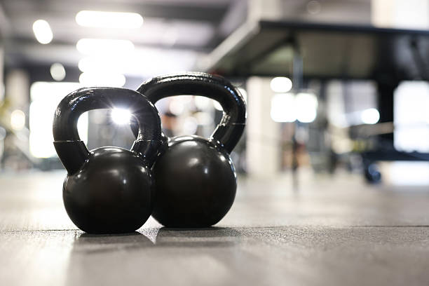 istock Black kettlebells on floor in gym, closeup. Space for text 2236759852