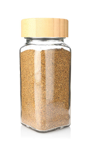 istock Ground caraway (Persian cumin) in glass jar isolated on white. Aromatic spice 2236760487