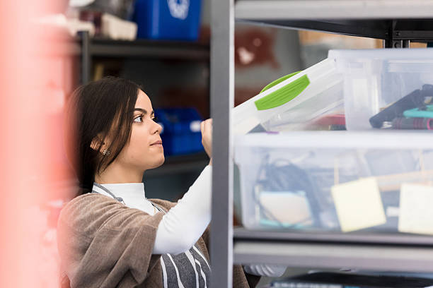 istock Young Woman Organizing Supplies in Office 2236762164