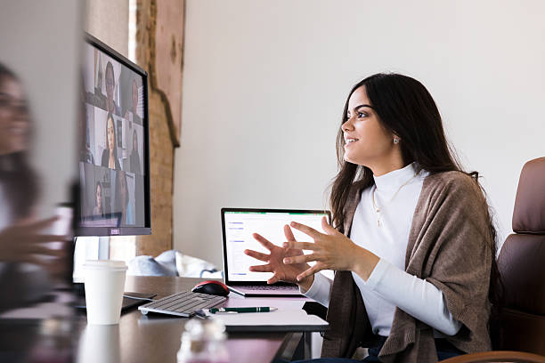 istock Young businesswoman in video conference, using laptop and computer 2236762174