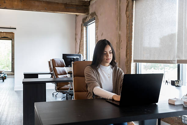 istock Young Woman Working on Laptop in Modern Office 2236762177