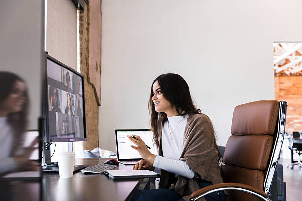 istock Young businesswoman in video conference, using laptop 2236762181