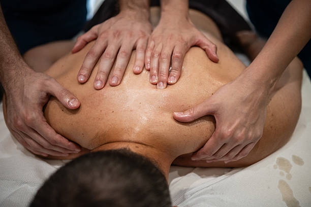 istock Relaxing four hands massage therapy for deep muscle tension relief 2236766181