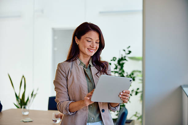 istock Confident businesswoman using digital tablet in modern office 2236766509