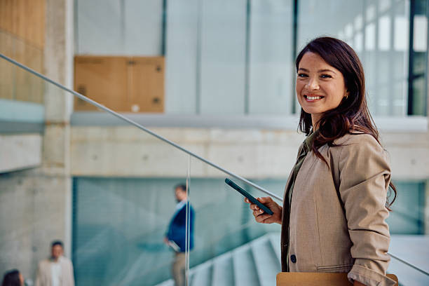 istock Confident young businesswoman smiling in modern office setting 2236767167