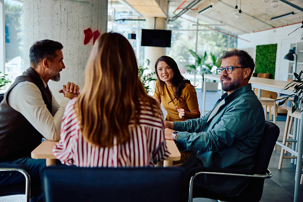 istock Group of diverse professionals having team discussion 2236767380