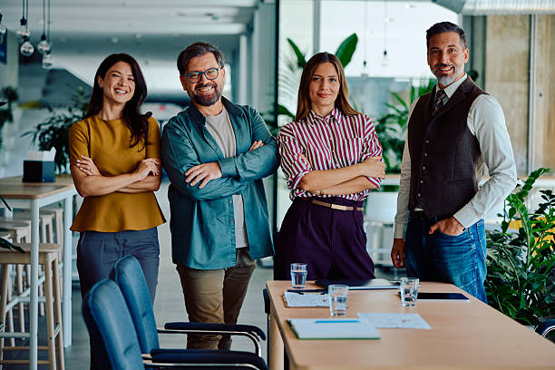 istock Confident business team standing together in modern office 2236767407