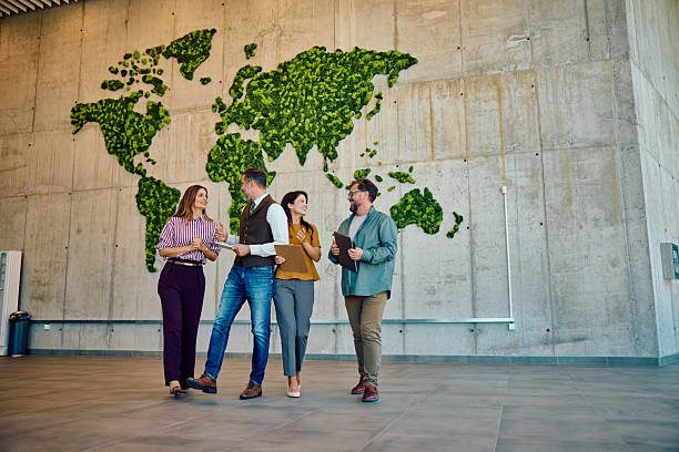 istock Successful business team collaboration in modern office with green world map 2236768021