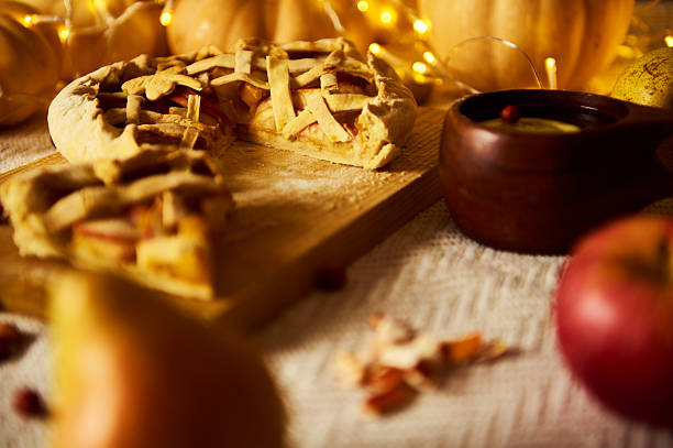 Close-up of a pie baking inside a warm oven with a golden crust, perfect for holidays and homemade cooking themes