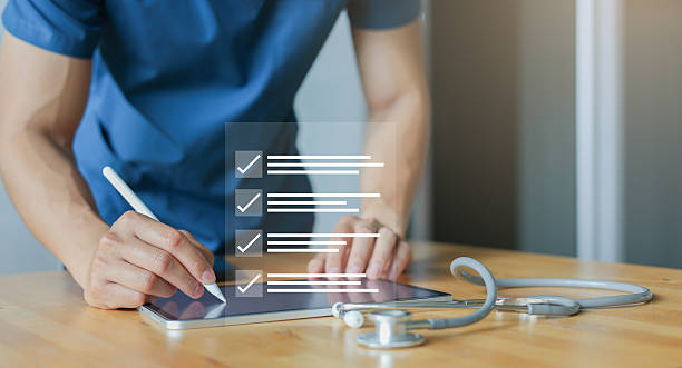 istock close up young general practitioner hand use stylus pen to check box on medical checklist or opd record to read and diagnose and assess about patient's symptom for healthy and lifestyle concept 2236769801
