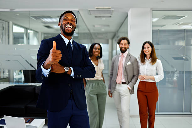 istock Group of diverse professionals smiling confidently together in modern office 2236769836