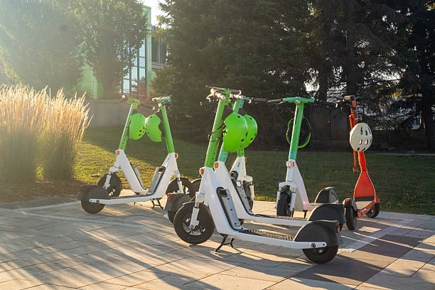 istock e-Scooter, E-Bike Parked on sidewalk near street 2236770029
