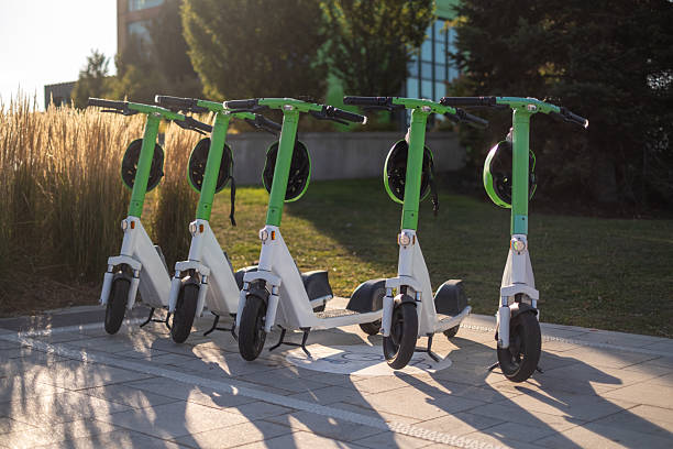 istock e-Scooter, E-Bike Parked on sidewalk near street 2236770041