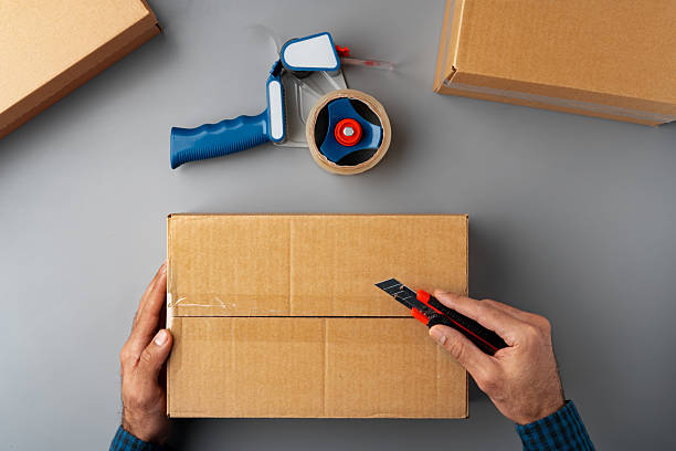 istock Above table top view of warehouse preparing post courier delivery package 2236770910