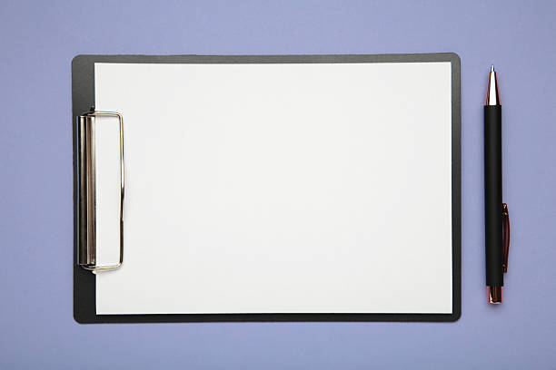 istock Pen and black clipboard with paper on purple background. 2236771492