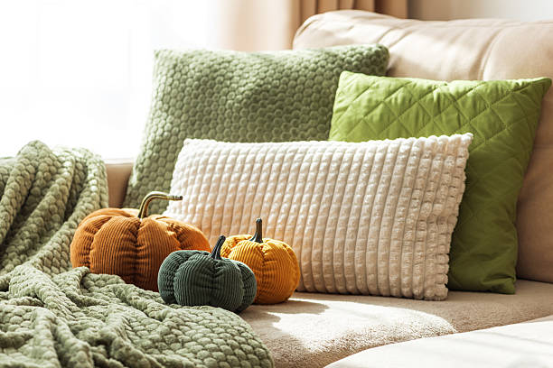 Cozy Autumn Sofa with Fabric Pumpkins and Textured Pillows