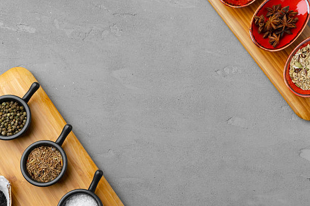 istock Small bowls with spices on gray background 2236774774