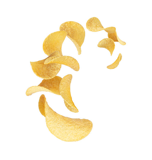 Crispy potato chips floating in the air on white background